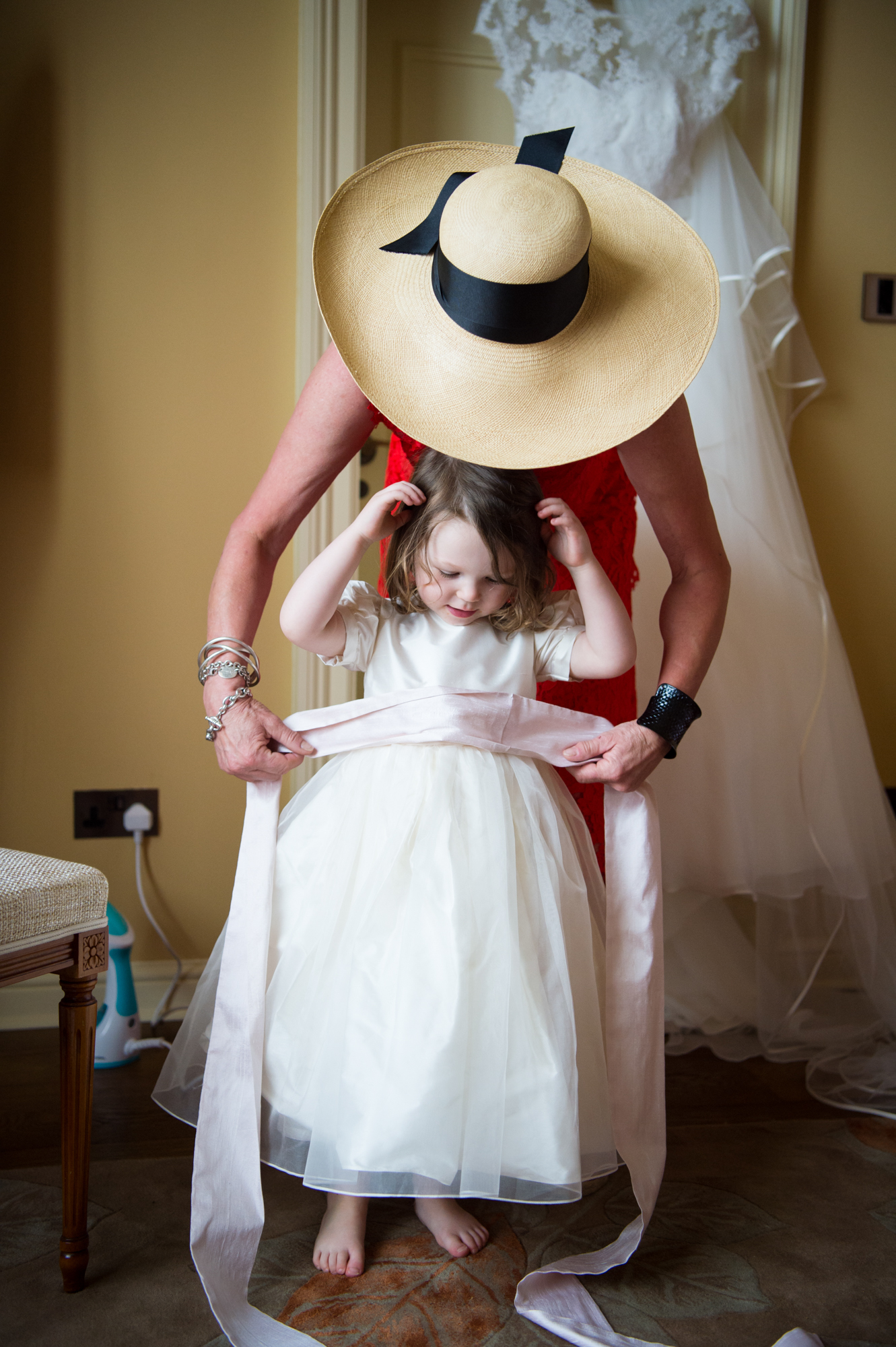 Flower girl getting dressed